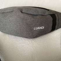 Серая сумка Luandi.Цена-160₽.Одевается через плечо и на пояс, в Барнауле